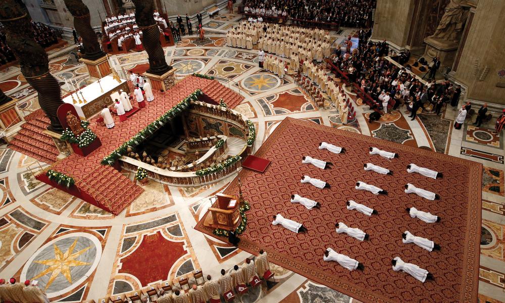 Newly ordained priests lie prostrate as Pope Francis leads a Mass in St. Peter Basilica at the Vatican, April 22